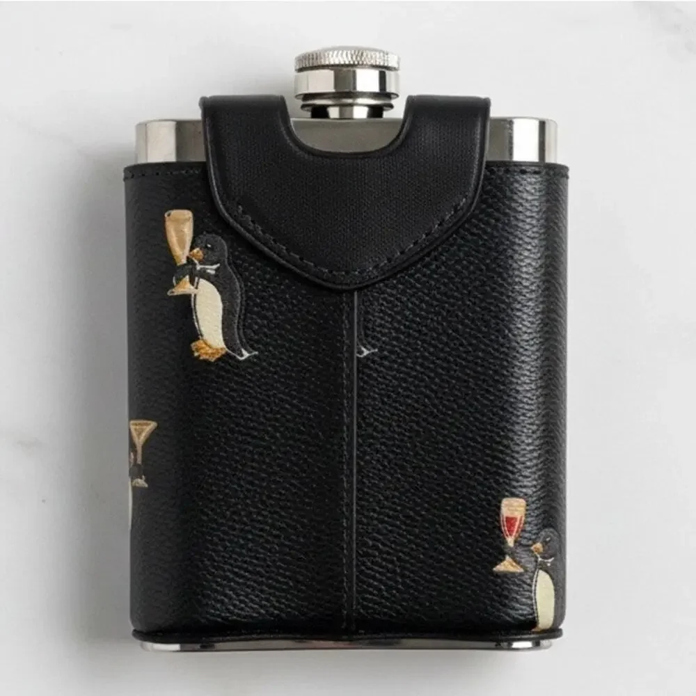 Coach flask penguin